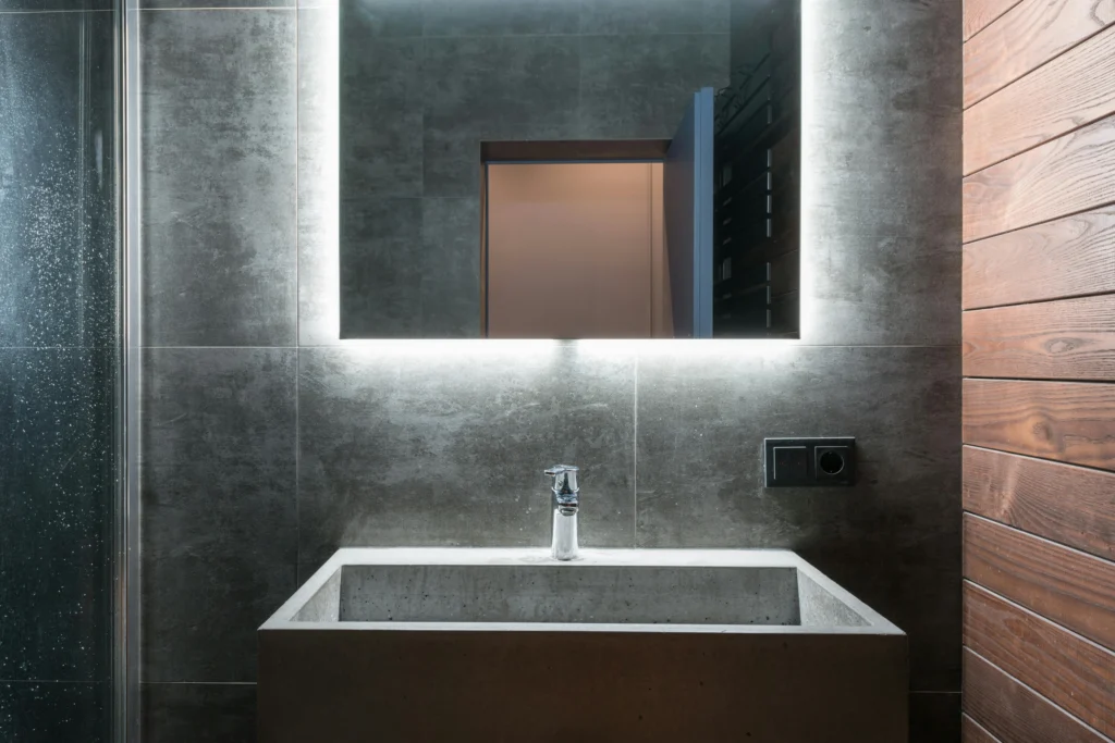 Baño Contemporáneo en Gris con Lavabo de Cemento